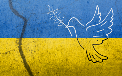 Symbolbild einer Friedenstaube in den Landesfarben der Ukraine.